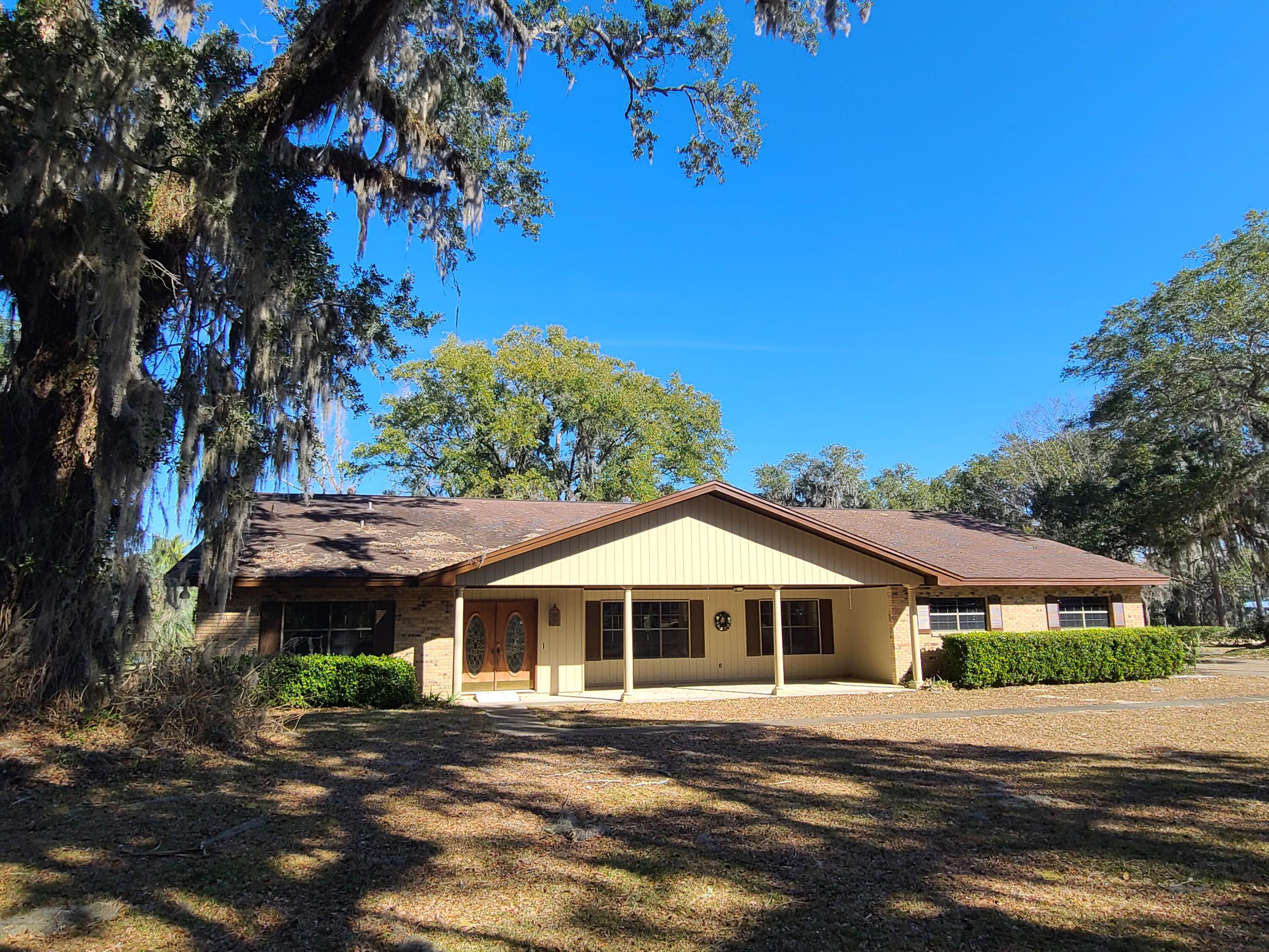 1066 Bay Grove Road Freeport, FL 32439 - Photo 8 of 85 a front view of a house with a yard