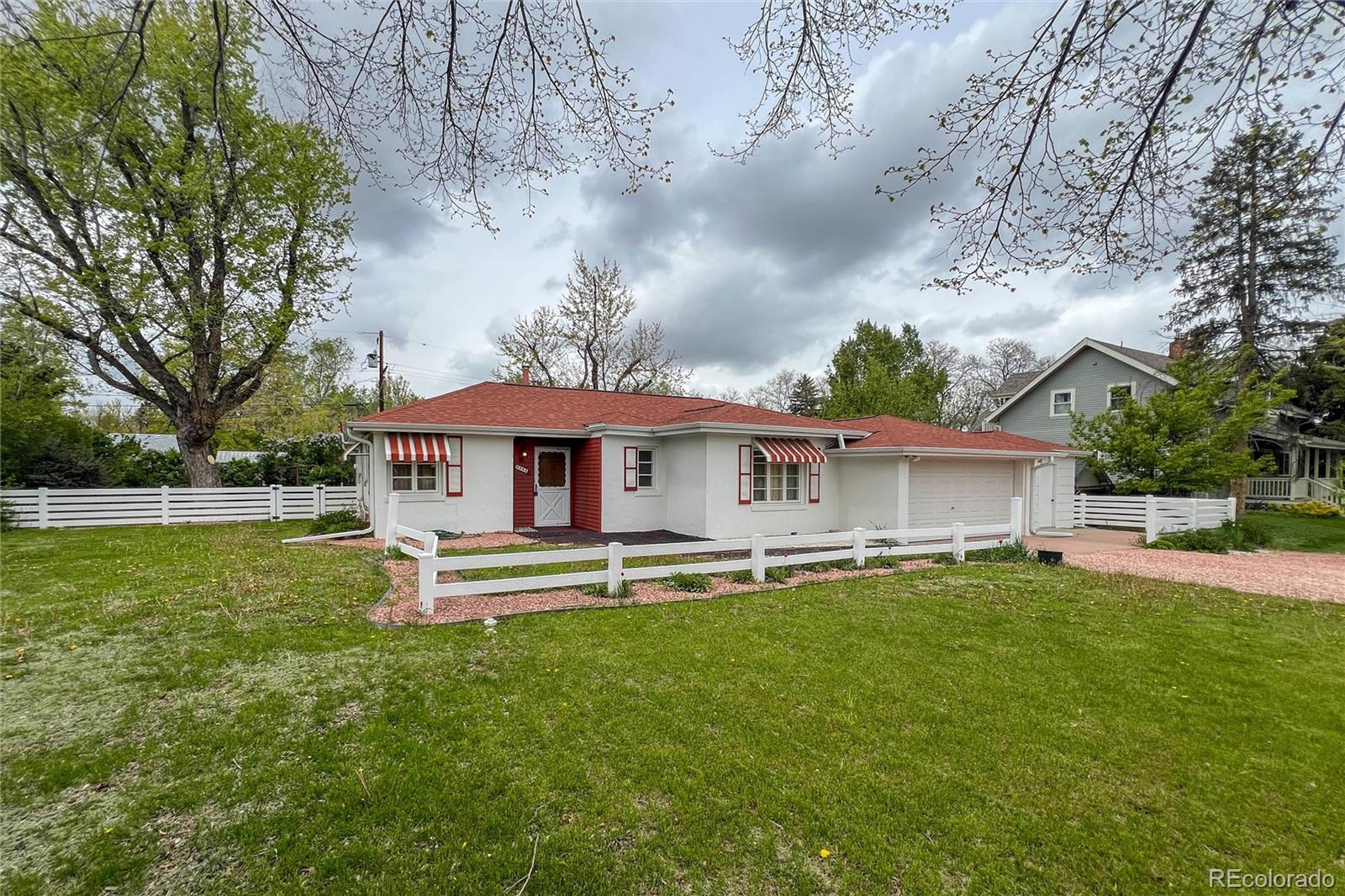 3345 Jay Street Wheat Ridge, CO 80033 - Photo 4 of 40 a house view with a sitting space and garden