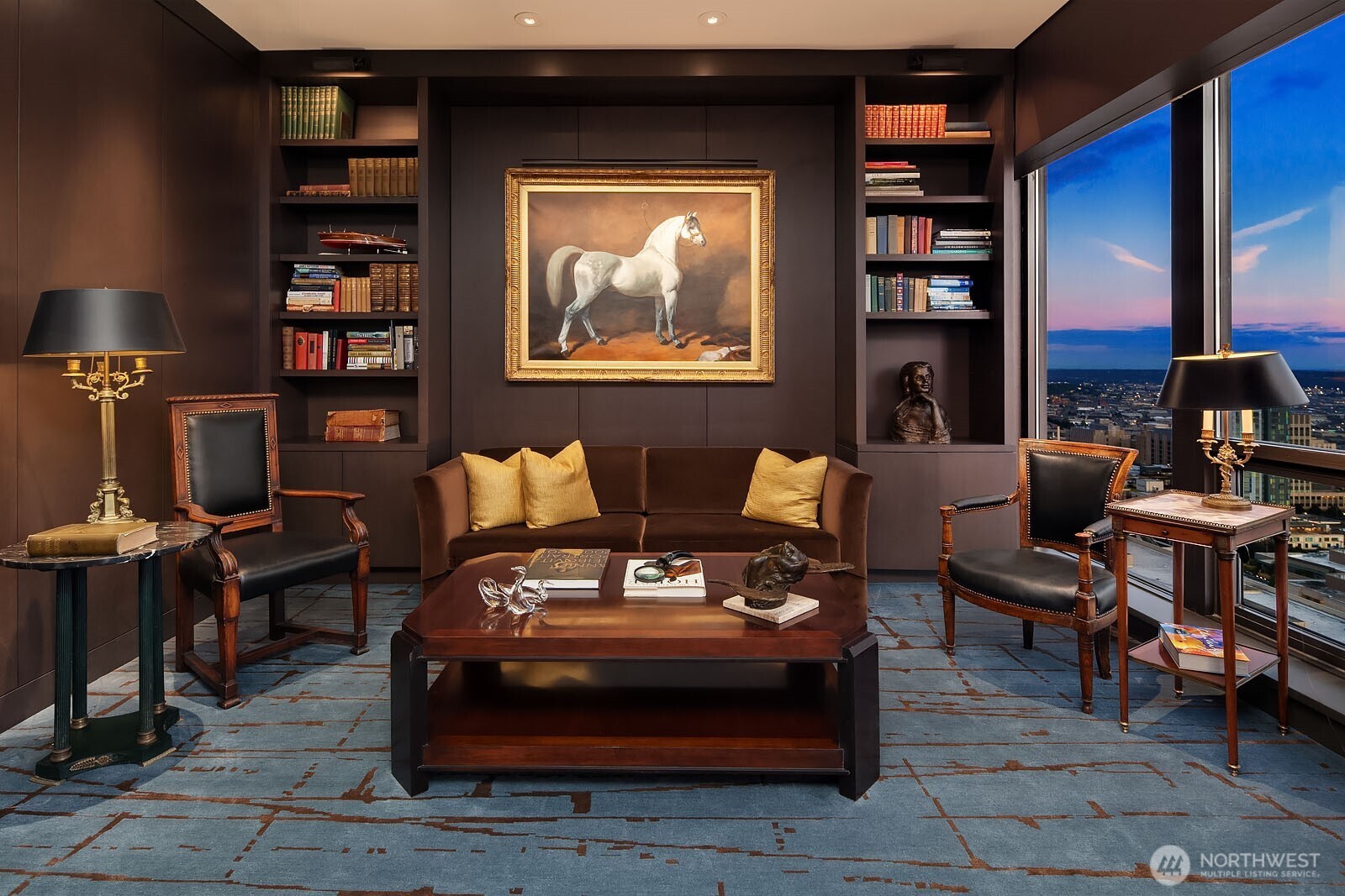 1301 Spring Street, Unit PH32 Seattle, WA 98104 - Photo 16 of 40 a living room with furniture and a bookshelf