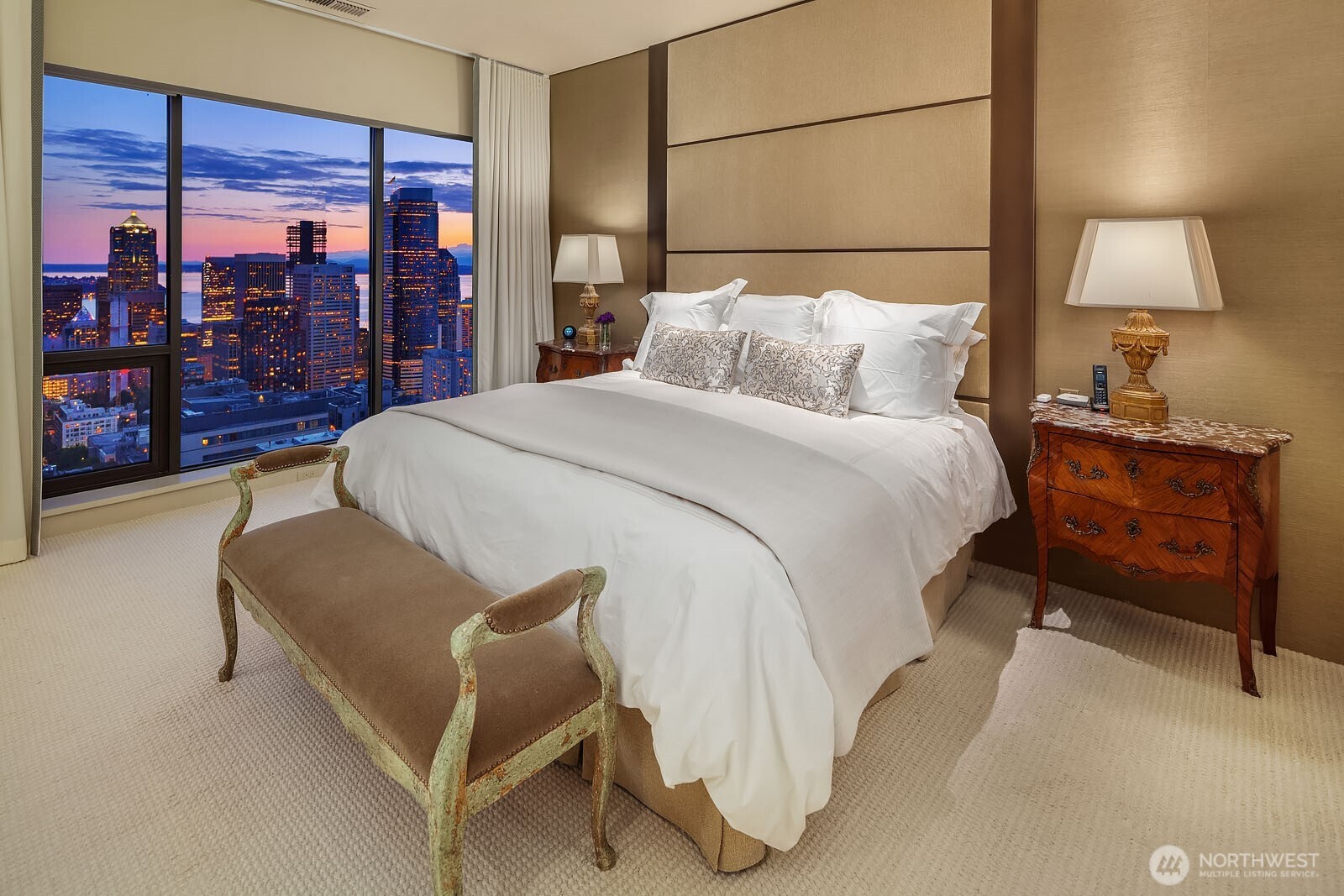 1301 Spring Street, Unit PH32 Seattle, WA 98104 - Photo 26 of 40 a bedroom with a bed and lamp