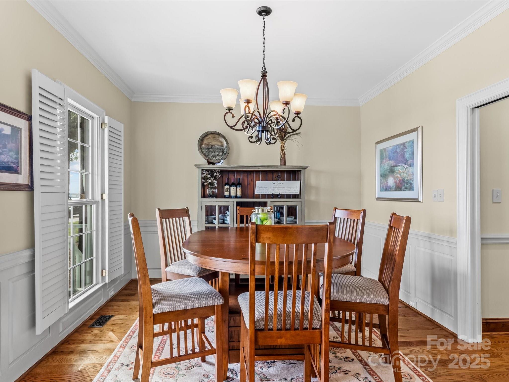 806 Lake Mist Drive Stanley, NC 28164 - Photo 15 of 47 a view of a dining room with furniture window and wooden floor