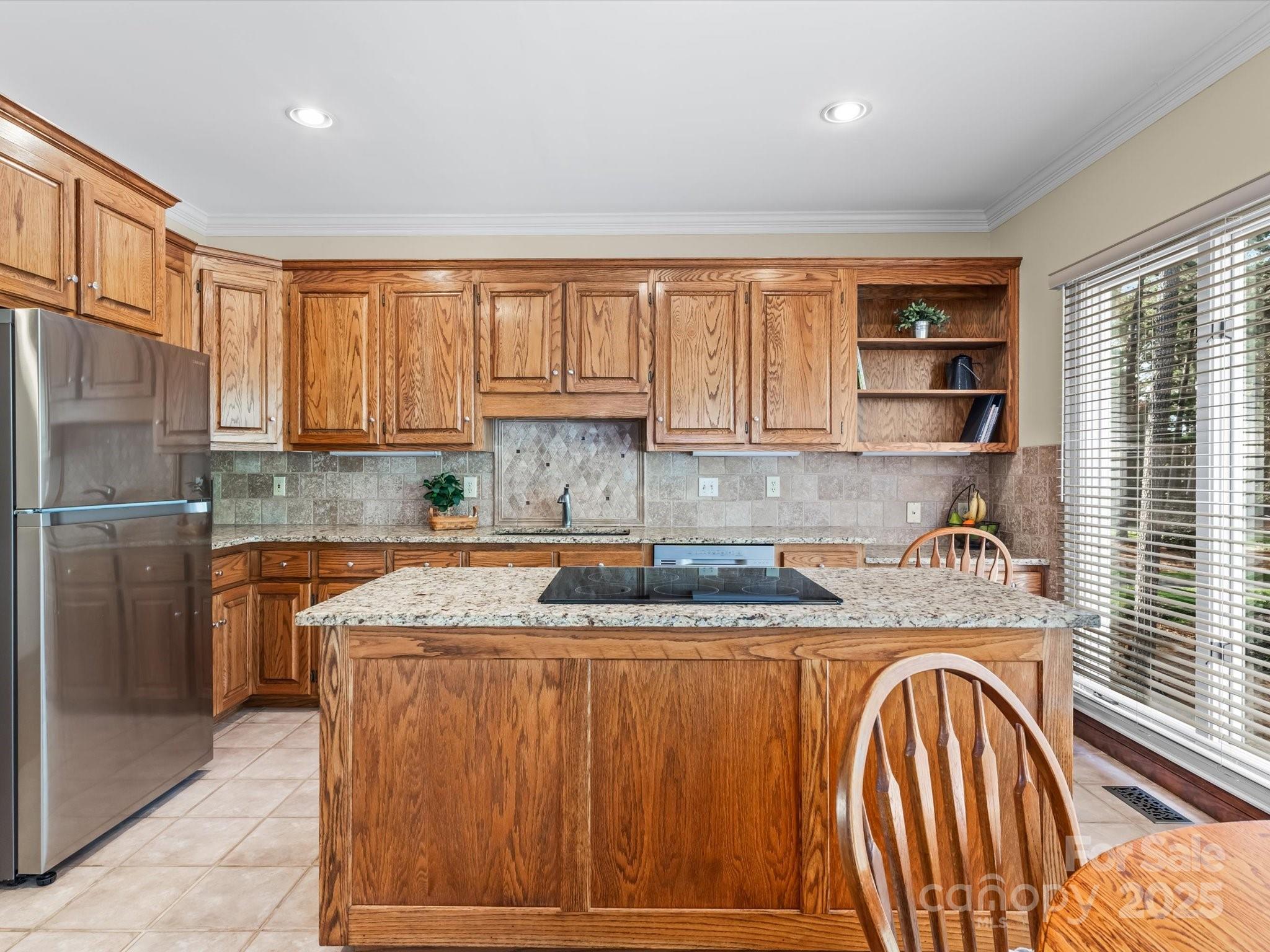 806 Lake Mist Drive Stanley, NC 28164 - Photo 22 of 47 a kitchen with stainless steel appliances granite countertop a sink refrigerator and cabinets