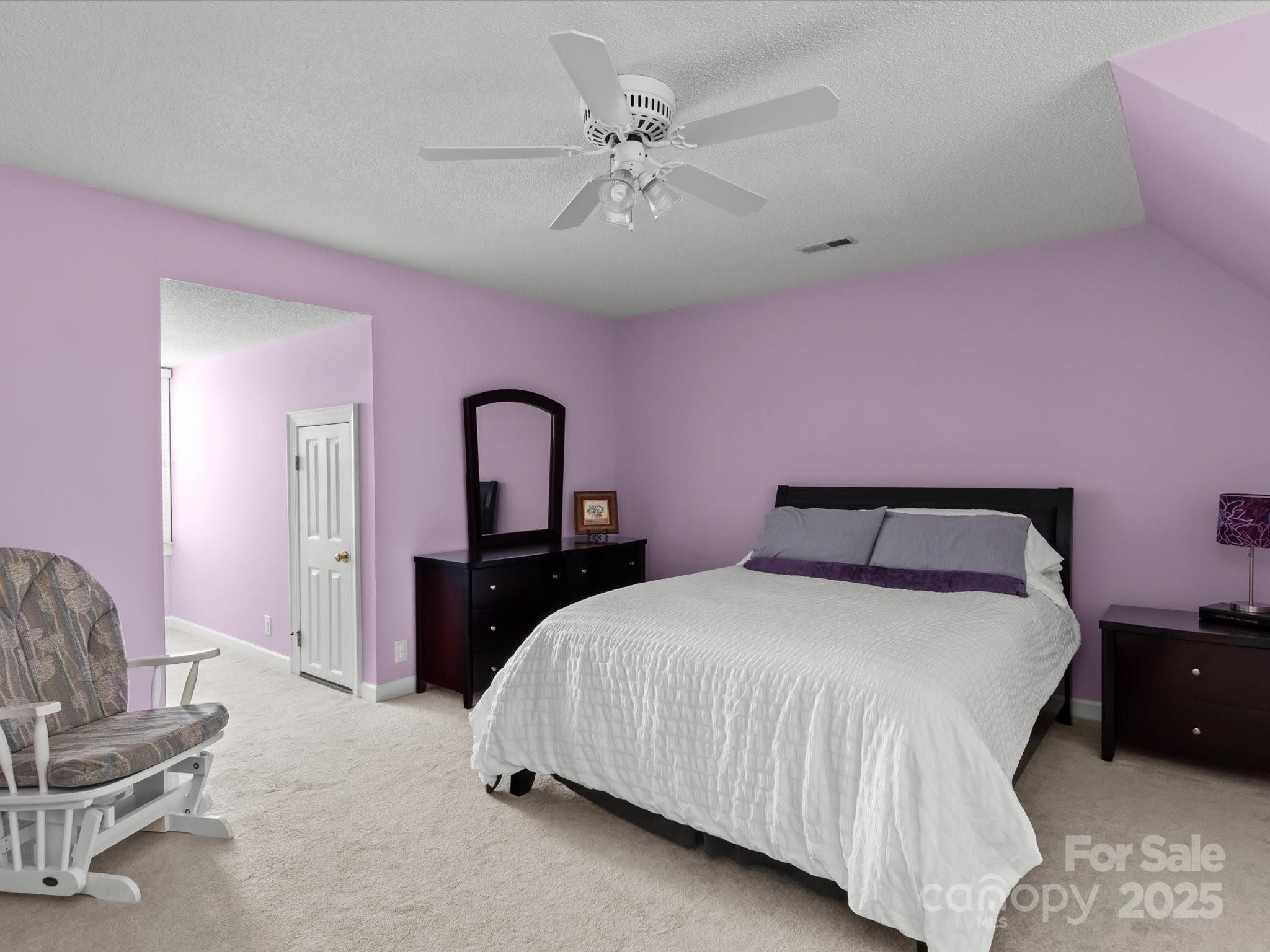 806 Lake Mist Drive Stanley, NC 28164 - Photo 35 of 47 a bedroom with a bed and a chandelier