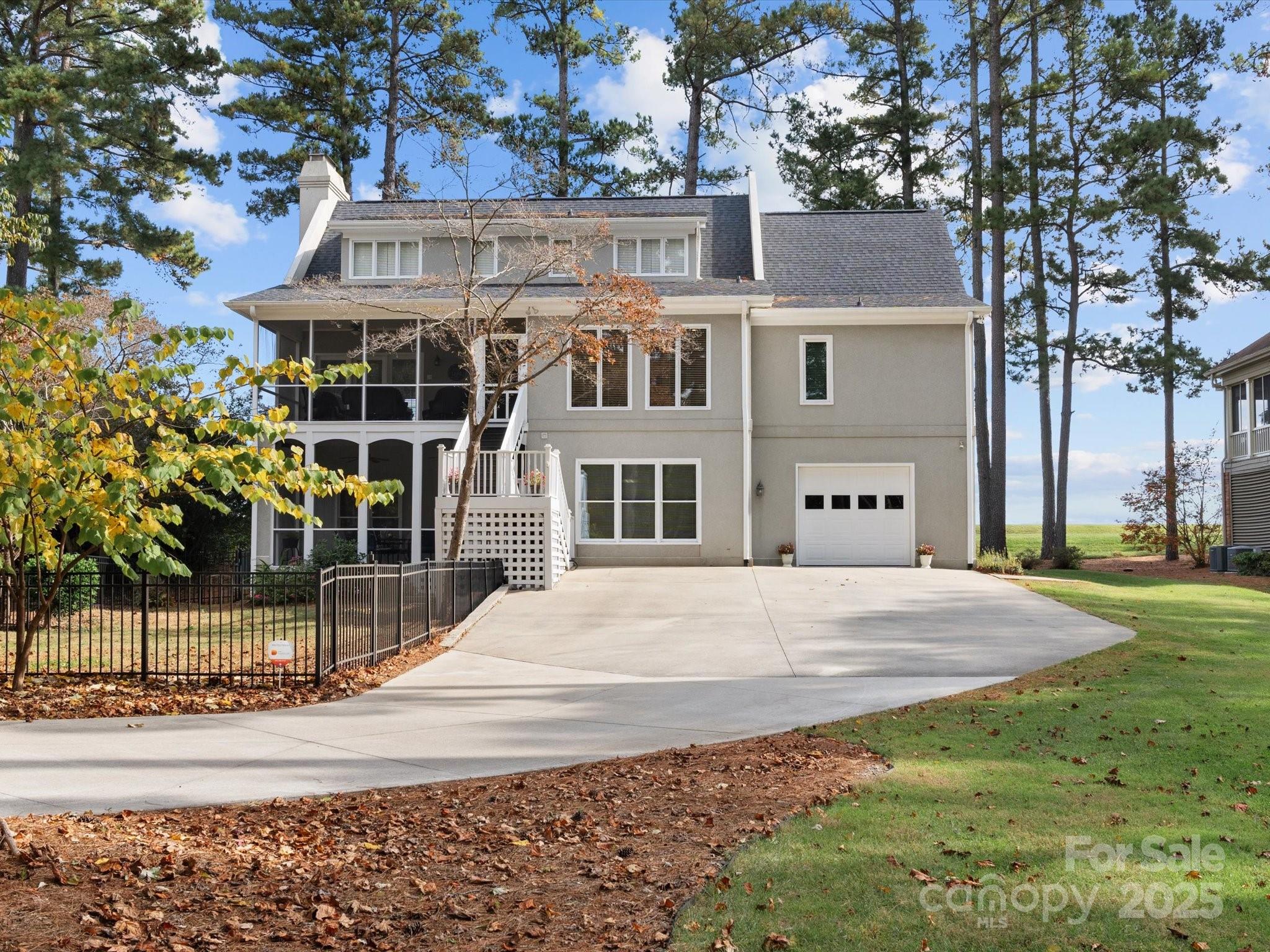 806 Lake Mist Drive Stanley, NC 28164 - Photo 47 of 47 a front view of a house with a yard and garage