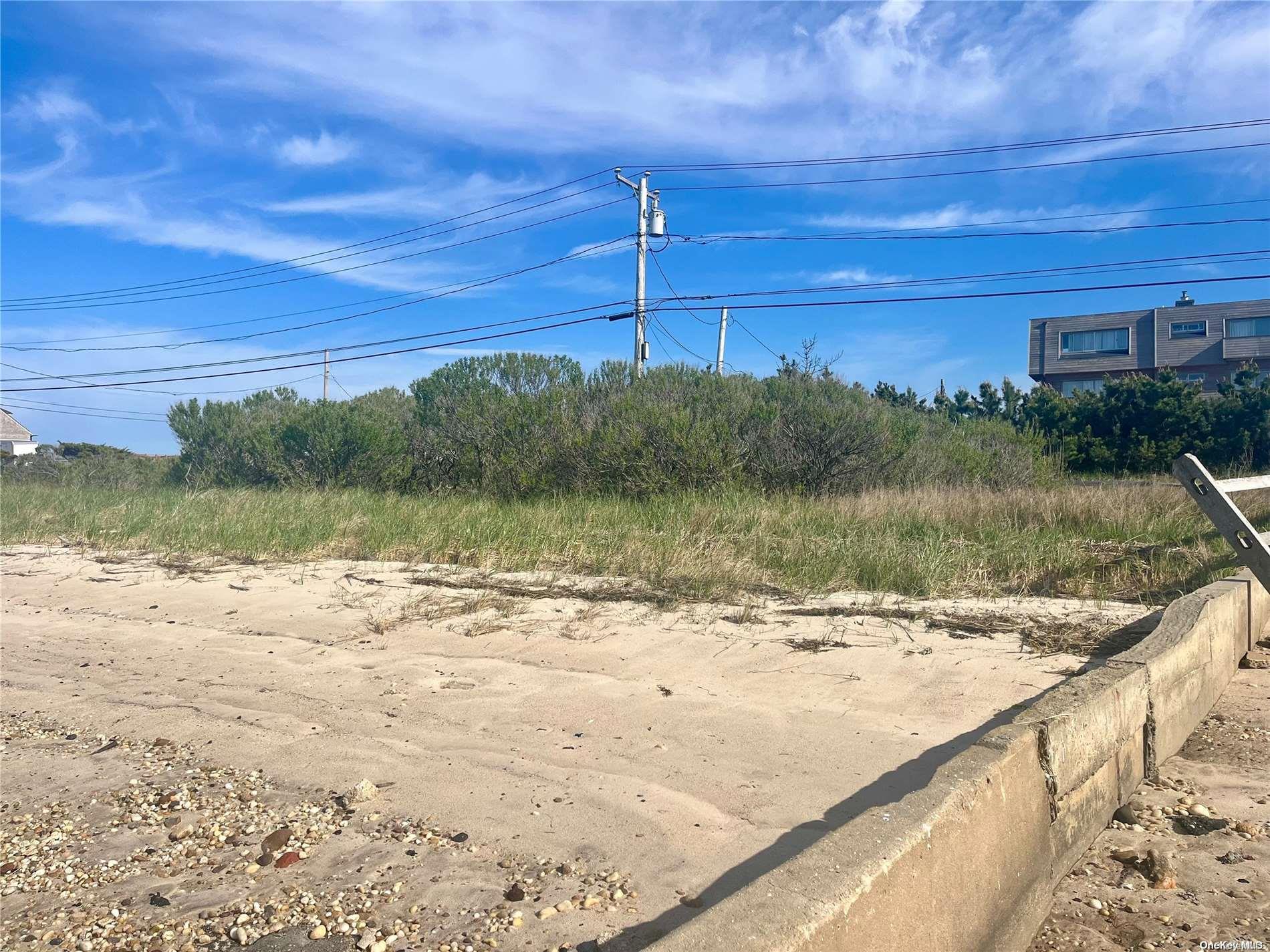 53 Dune Road Hampton Bays, NY 11959 - Photo 12 of 20 a view of a lake with a beach