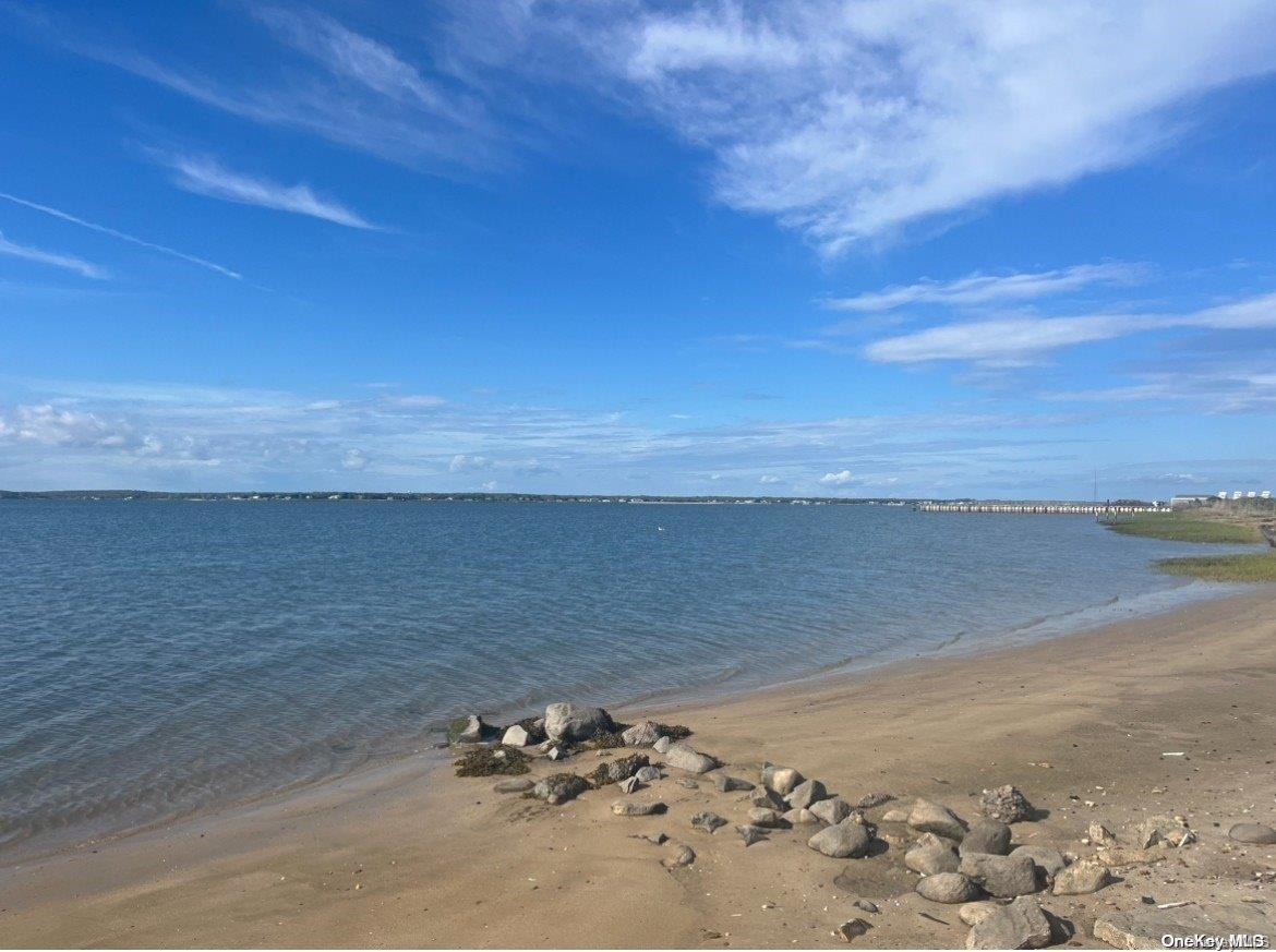 53 Dune Road Hampton Bays, NY 11959 - Photo 13 of 20 a view of ocean view with beach
