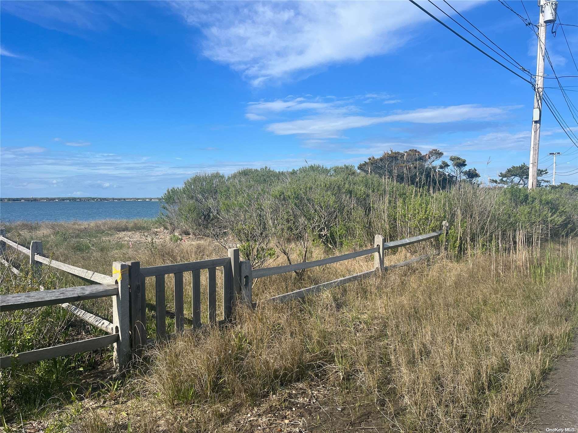 53 Dune Road Hampton Bays, NY 11959 - Photo 10 of 20 a view of a lake with a mountain