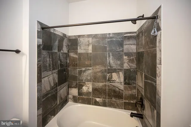 a bathroom with a shower and toilet