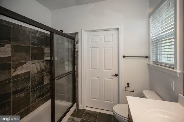 a bathroom with a sink double vanity and a mirror