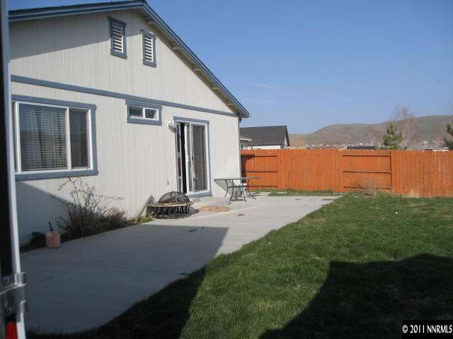 17780 Fairfax Court Reno, NV 89508 - Photo 11 of 13 a front view of a house with a yard