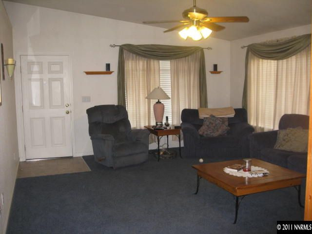 17780 Fairfax Court Reno, NV 89508 - Photo 4 of 13 a living room with furniture and a large window