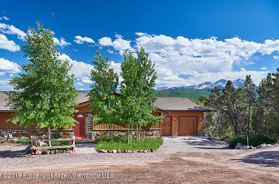 84 Palo Verde Road Carbondale, CO 81623 - Photo 1 of 24 Front of Home with Elk Mtn Range behind