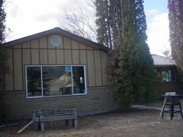 300 Allan Road Naches, WA 98937 - Photo 1 of 1 a wooden bench sitting in front of a building