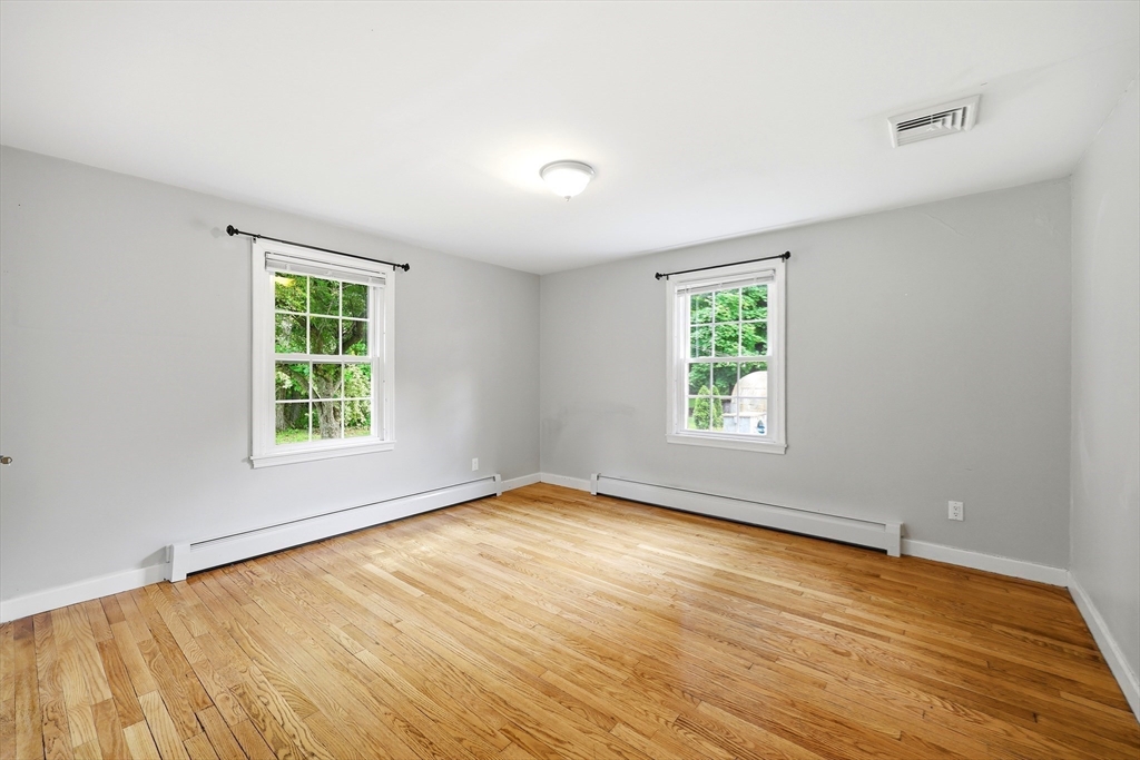 130 Connecticut Avenue Springfield, MA 01107 - Photo 32 of 40 a view of an empty room with wooden floor and a window