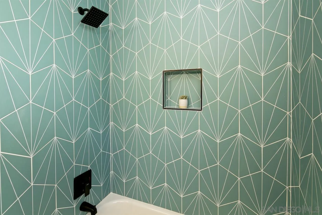 725 Cathy Lane Encinitas, CA 92007 - Photo 11 of 31 a bathroom with a shower and a toilet