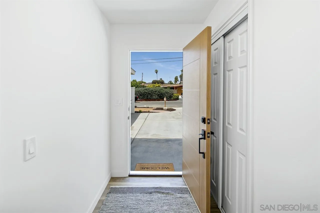725 Cathy Lane Encinitas, CA 92007 - Photo 28 of 31 a bathroom with a glass shower door