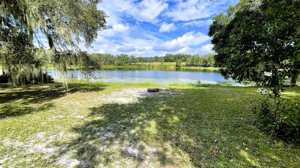 151 Twin Lakes Road Hawthorne, FL 32640 - Photo 19 of 28 a view of a lake with houses in the background