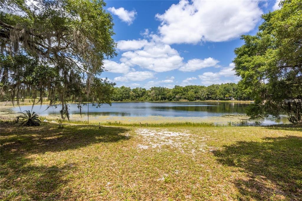 151 Twin Lakes Road Hawthorne, FL 32640 - Photo 2 of 28 a view of a lake with houses in the background