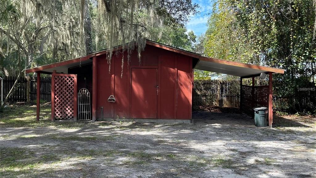 151 Twin Lakes Road Hawthorne, FL 32640 - Photo 25 of 28 a view of a barn with a small yard