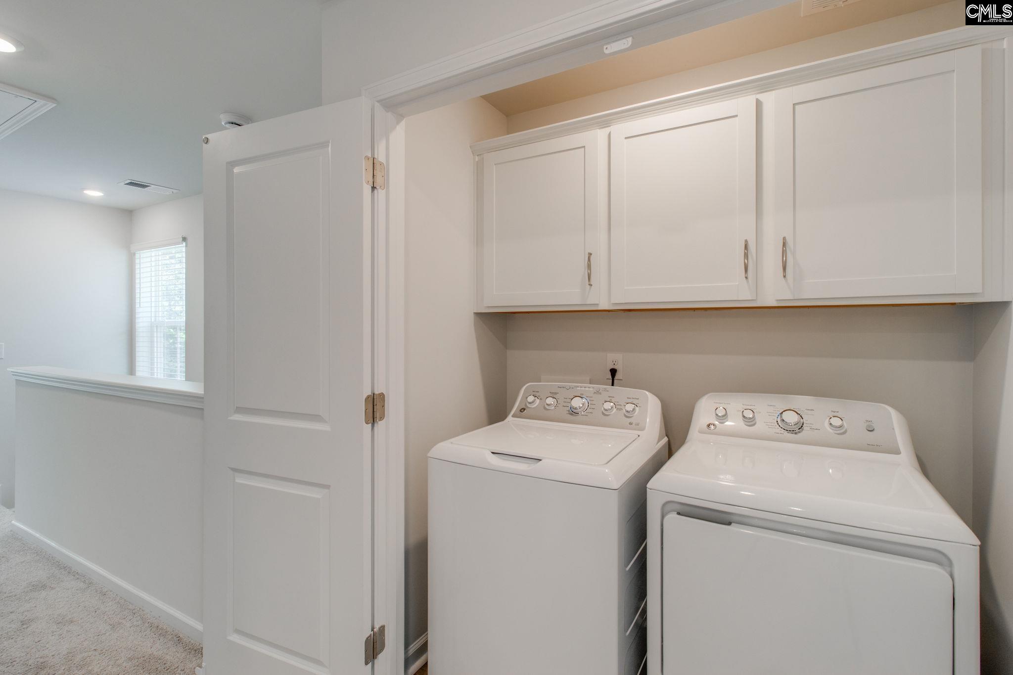312 Reedmace Court Lexington, SC 29072 - Photo 20 of 29 a view of storage and utility room with washer and dryer