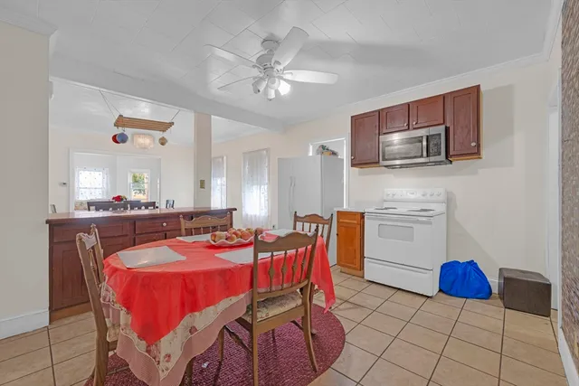 a dining room with furniture and window