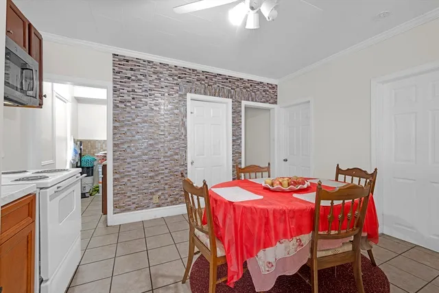 a dining room with furniture and chandelier
