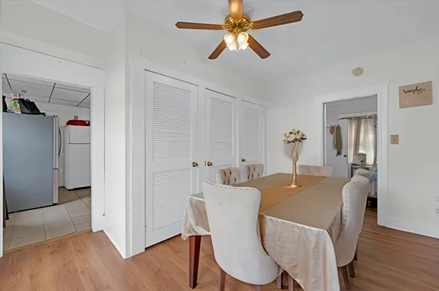 a view of a dining room with furniture wooden floor and chandelier