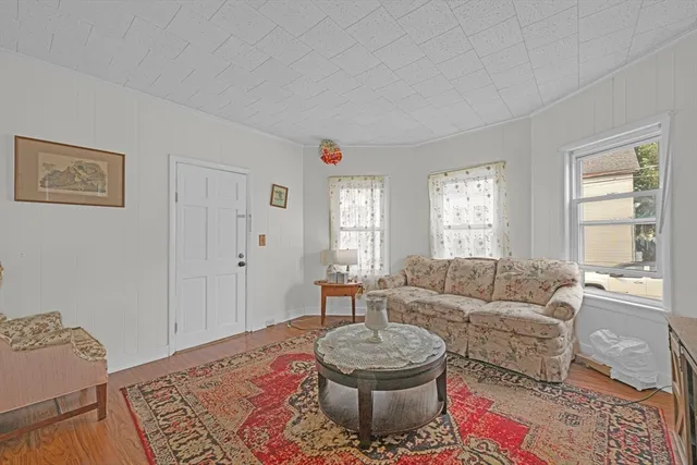 a living room with furniture and a rug