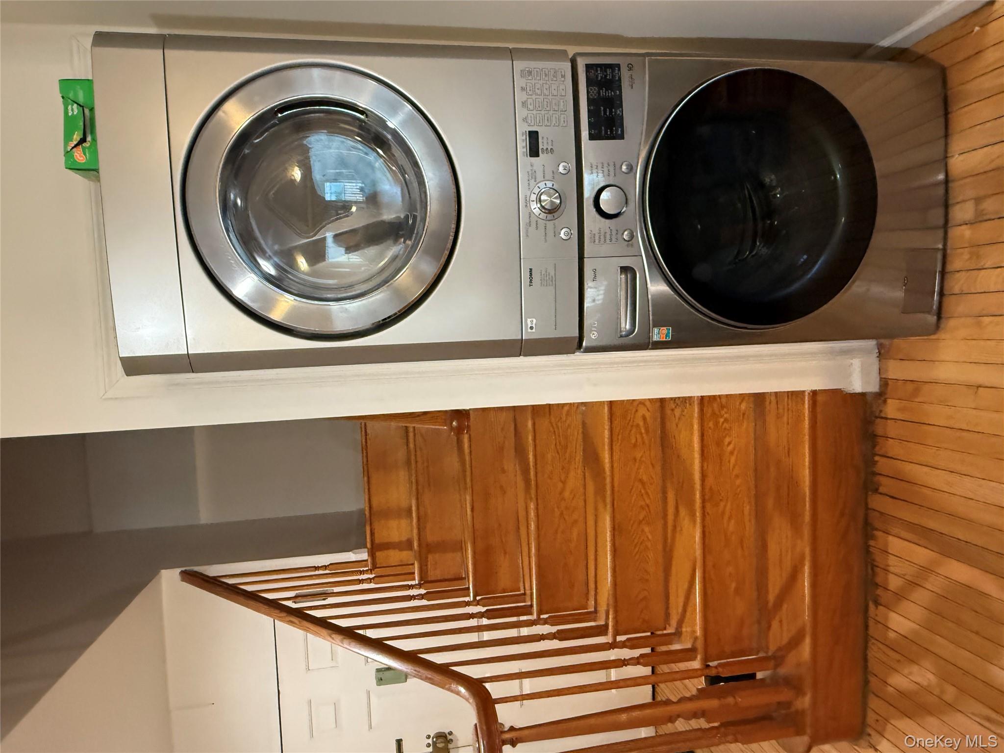 42-31 Colden Street, Unit F7A Queens, NY 11355 - Photo 6 of 18 a utility room with dryer and washer