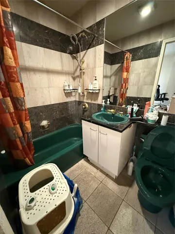 a bathroom with a sink mirror and vanity