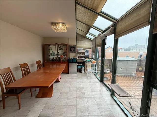 a view of a chairs and table in a balcony