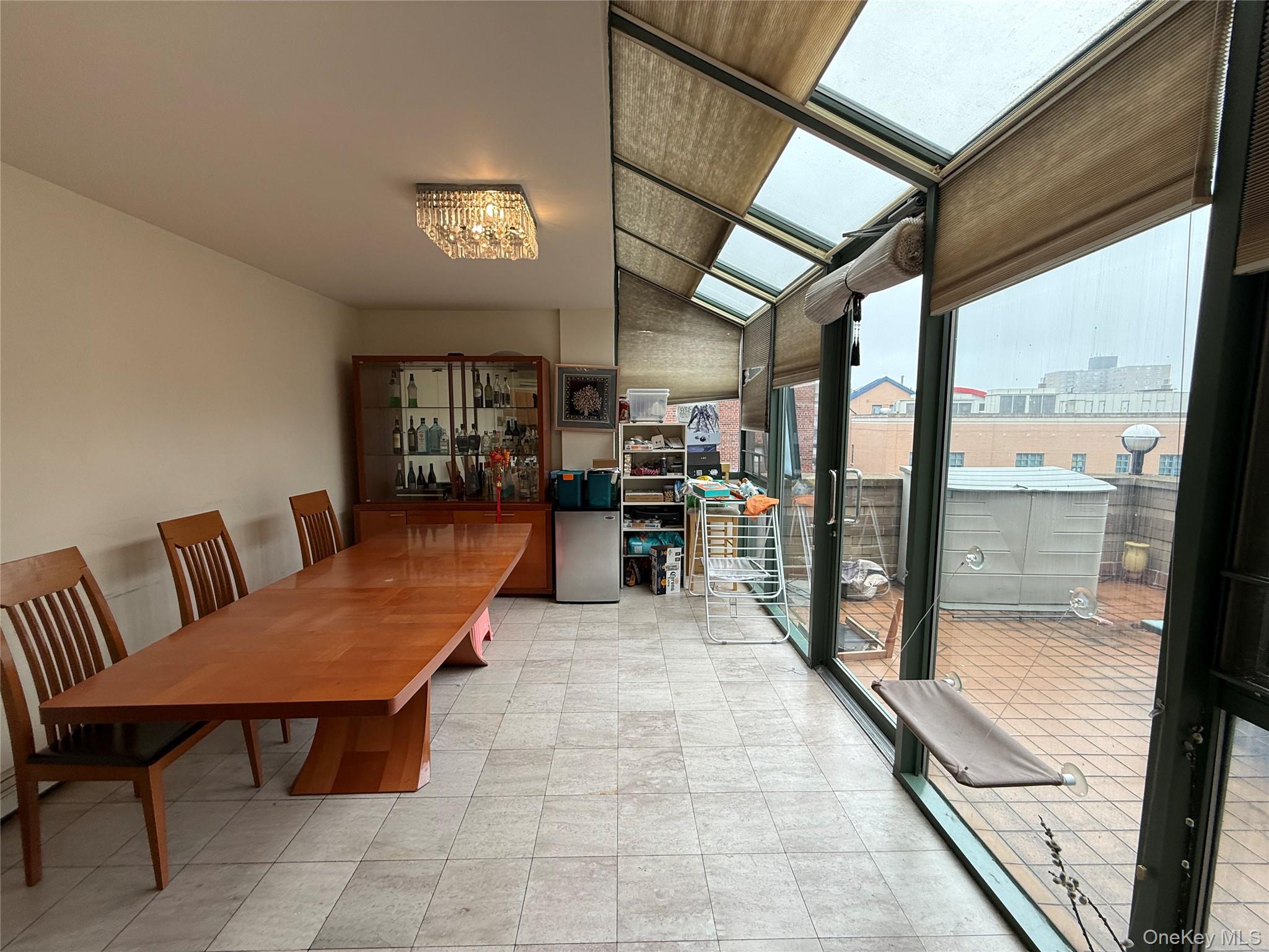 42-31 Colden Street, Unit F7A Queens, NY 11355 - Photo 9 of 18 a view of a chairs and table in a balcony