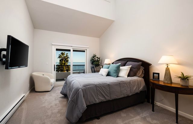 a view of a chairs and table in the balcony