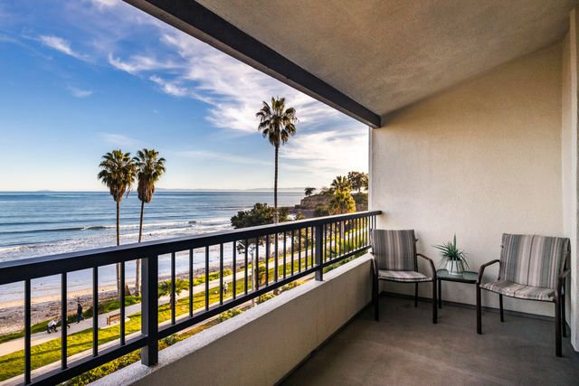 a view of closet area with rug and white walls