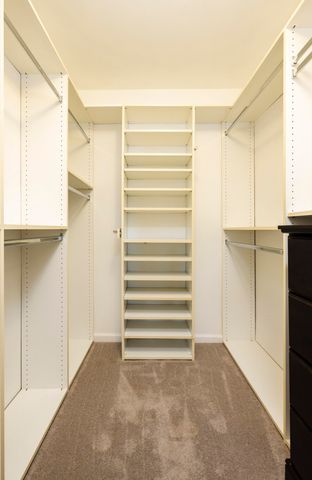 a bathroom with double vanity sinks and a mirror