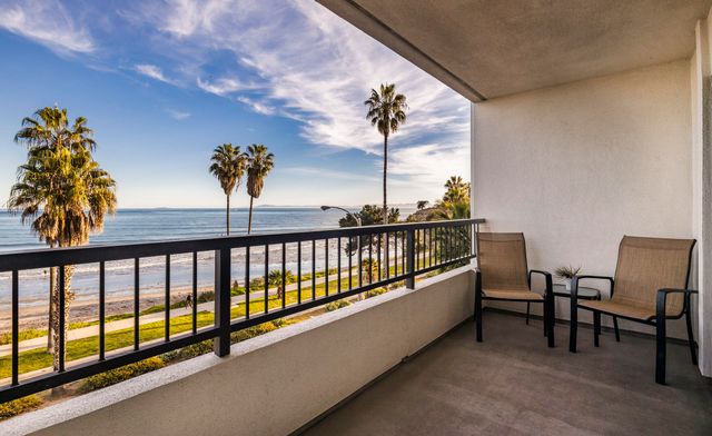 a view of a balcony with chairs