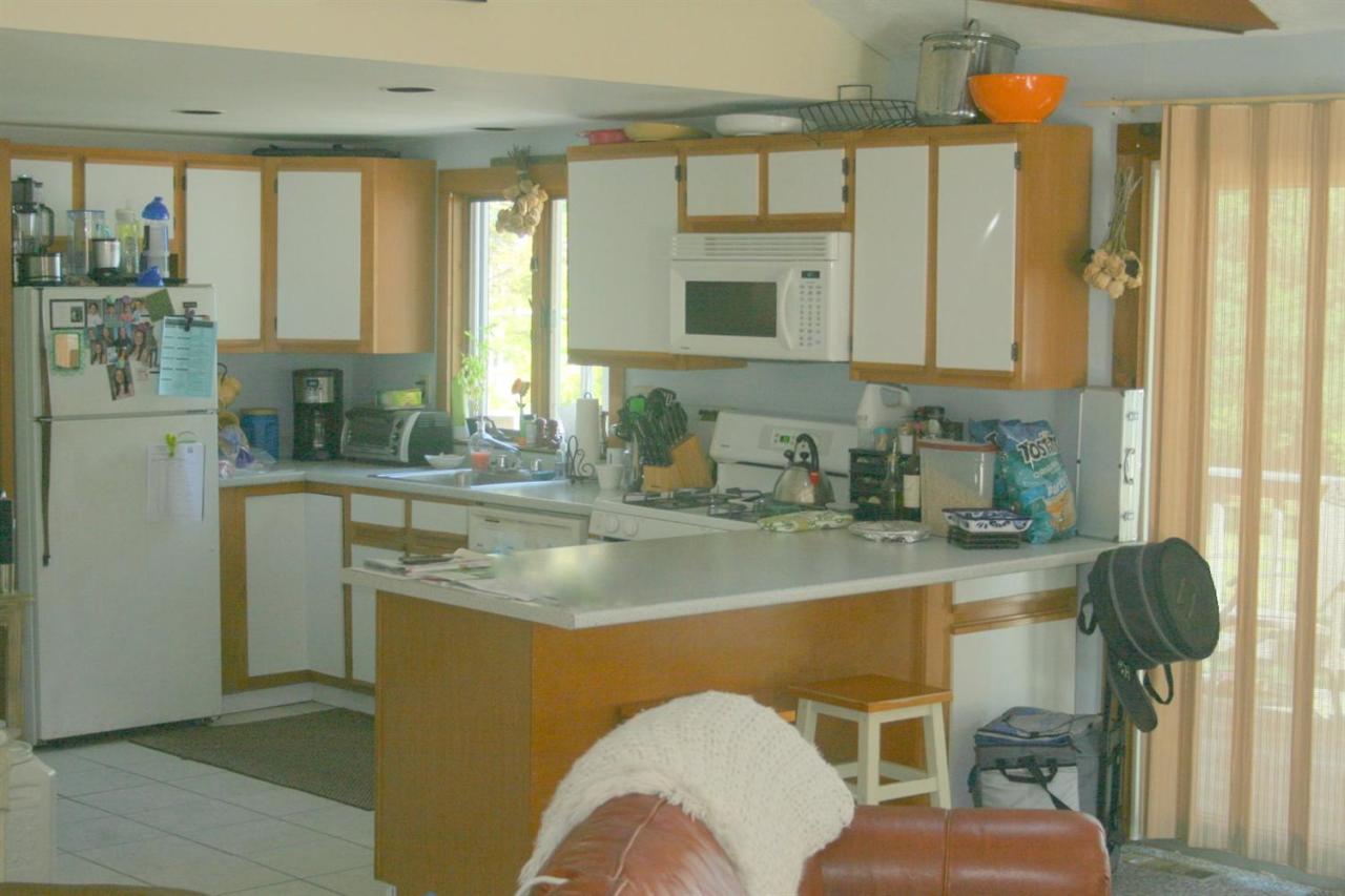 164 Annable Point Road Centerville, MA 02632 - Photo 12 of 13 a kitchen with stainless steel appliances granite countertop a sink a stove and a refrigerator