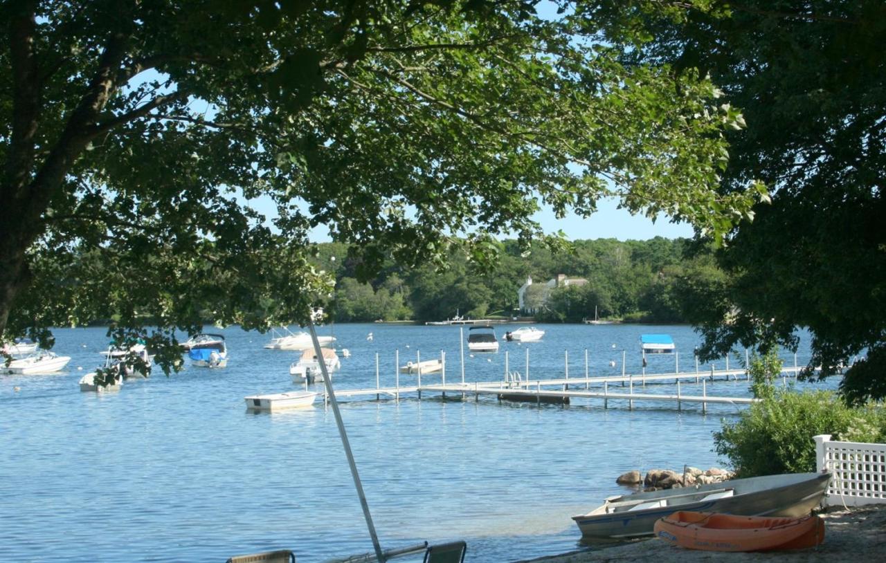 164 Annable Point Road Centerville, MA 02632 - Photo 13 of 13 a view of a lake with a house in the background