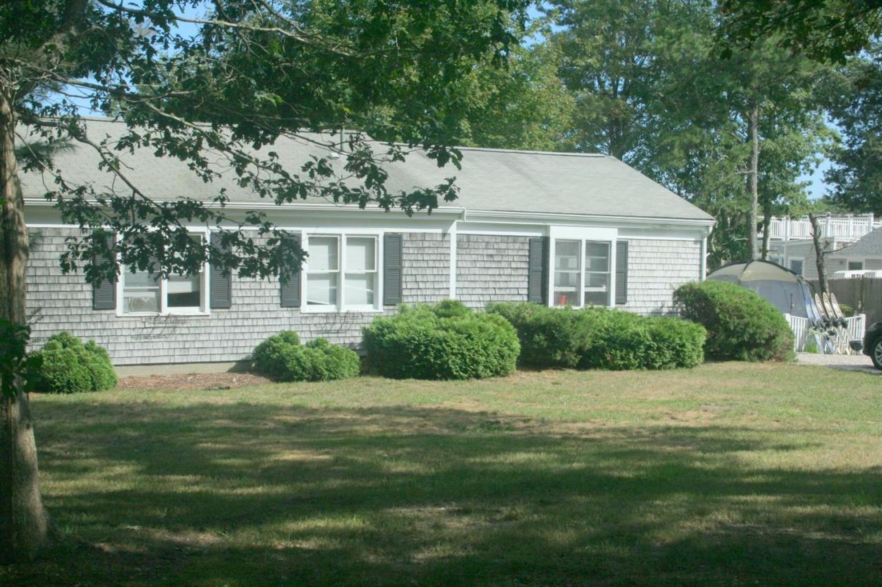 164 Annable Point Road Centerville, MA 02632 - Photo 2 of 13 a front view of a house with a yard