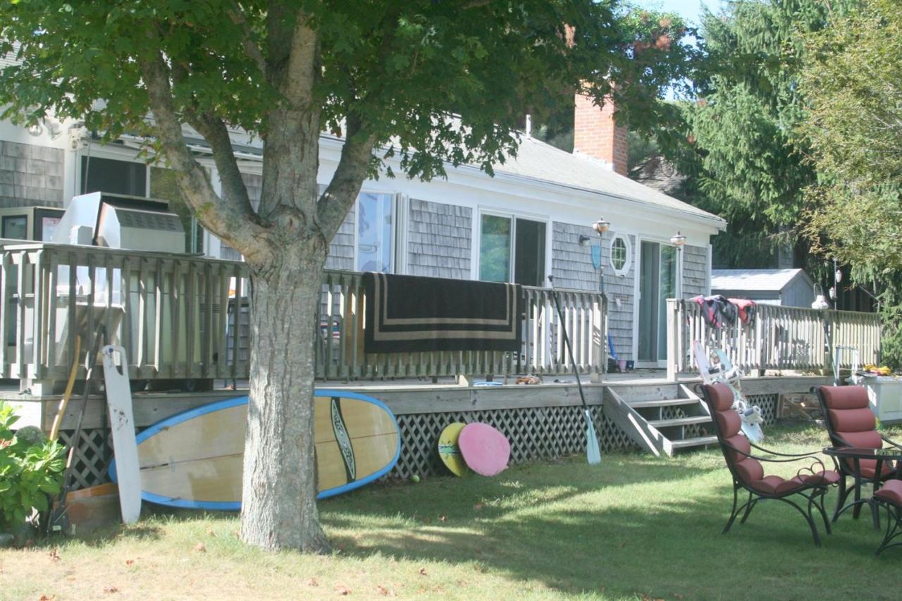 164 Annable Point Road Centerville, MA 02632 - Photo 10 of 13 a front view of a house with swimming pool and furniture