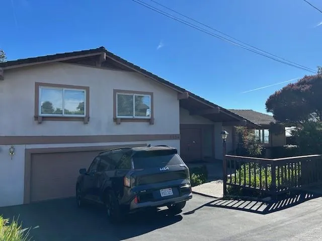 a car parked in front of a house