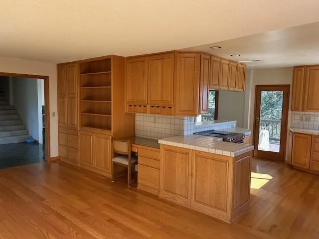 a view of a room with furniture and window