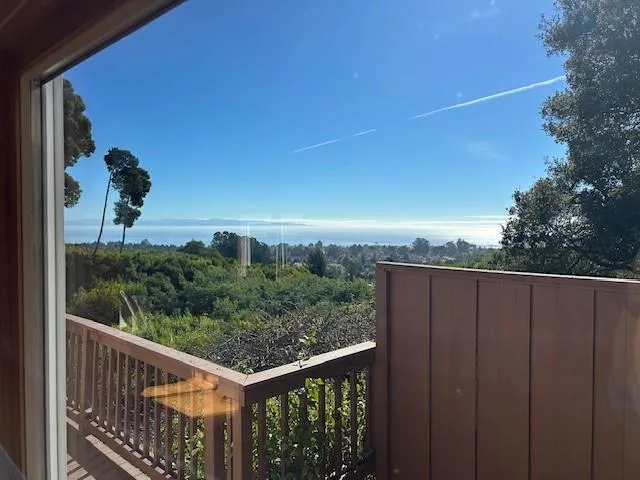 a view of a balcony with an outdoor space