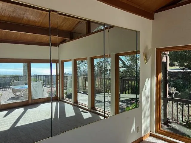 a room with a balcony a bed