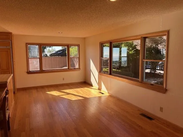 a kitchen with stainless steel appliances granite countertop a stove and a sink