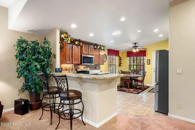 a kitchen with a table and chairs in it