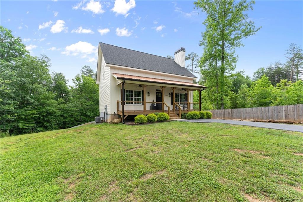 1300 Preacher Campbell Road Clarkesville, GA 30523 - Photo 25 of 34 a view of a house with backyard and porch