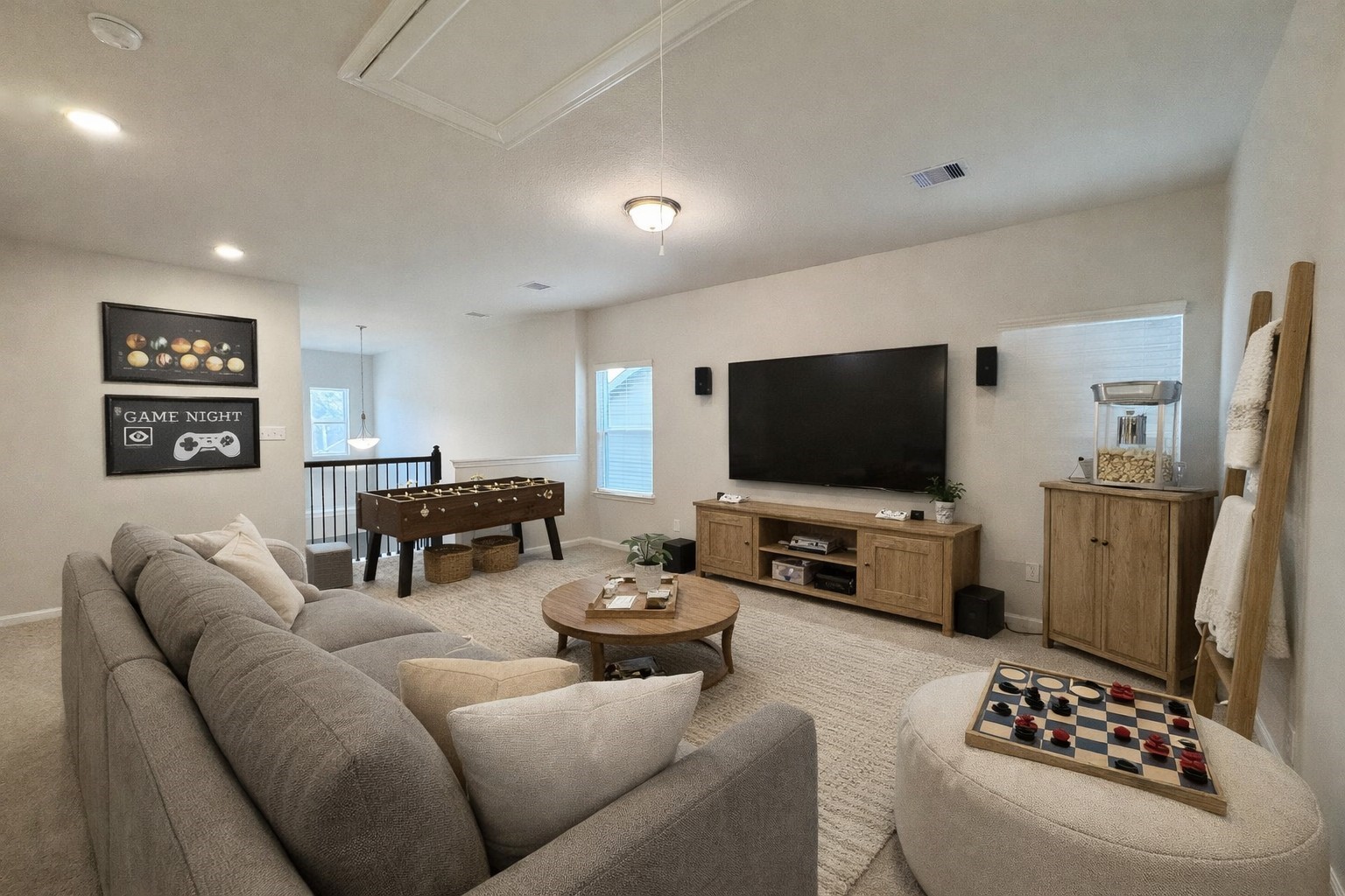 9749 Enclave Ridge Road Willis, TX 77318 - Photo 12 of 19 a living room with furniture and a flat screen tv