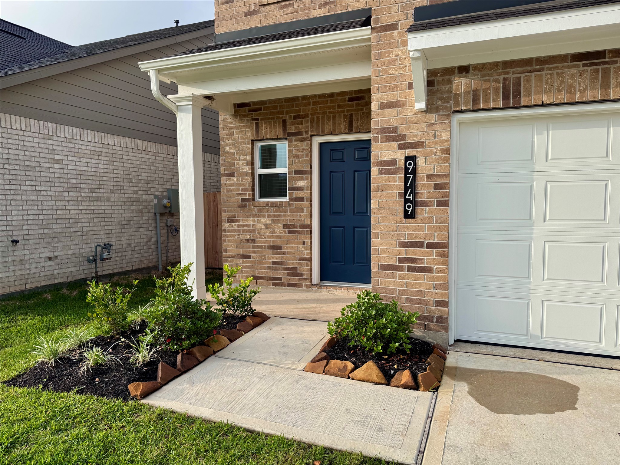 9749 Enclave Ridge Road Willis, TX 77318 - Photo 2 of 19 front view of a house with a garden
