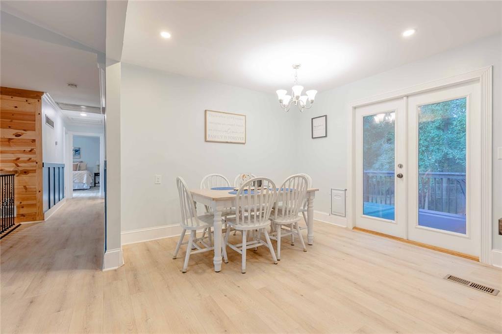 6375 Caladium Drive Acworth, GA 30102 - Photo 17 of 41 a view of a dining room with furniture and chandelier